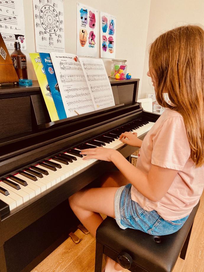 Student at the piano in Natalie's home studio